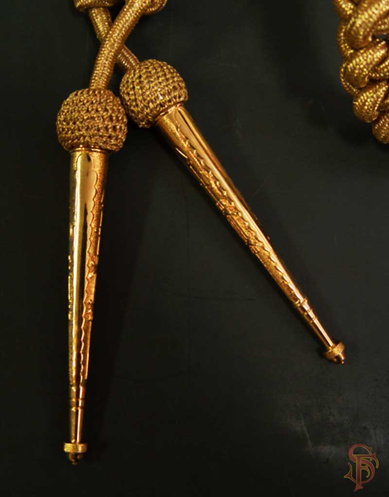 Gold Aiguillette tips on metallic cord, shoulder accoutrement