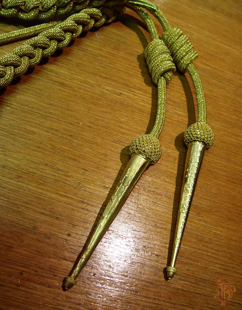 Gold Aiguillette tips on metallic cord, shoulder accoutrement